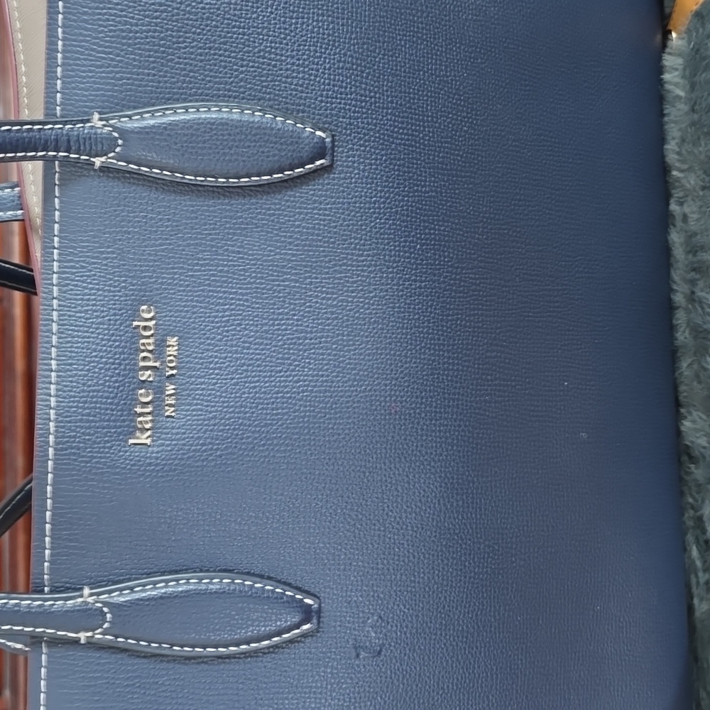 Beautiful  kate spade roomy tote with little pouch.